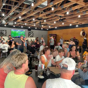 a large group of people sitting at tables