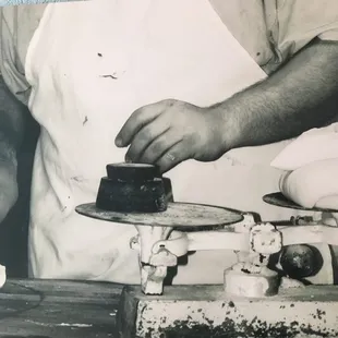 Tony at our partner bakery, Neatos Bakery is weighing and prepping to make yummy fresh bread