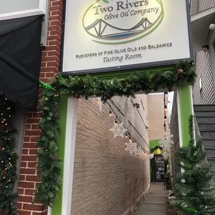 a sign for two rivers olive oil company