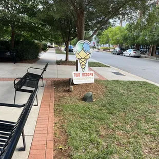 a sign on the sidewalk