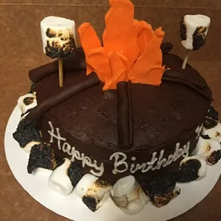 a birthday cake with marshmallows and marshmallows
