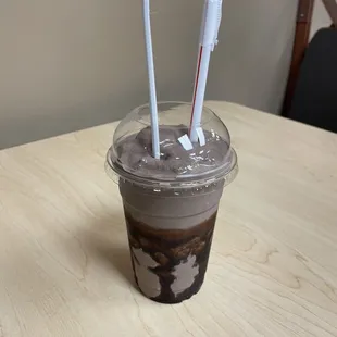 a cold drink in a plastic cup