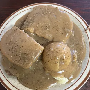 Whole hot beef sandwich with mashed potatoes.