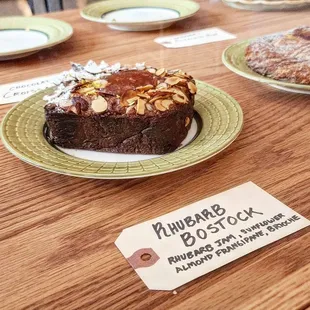 a chocolate cake on a plate with a price tag