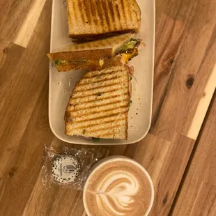 a sandwich and a cup of coffee