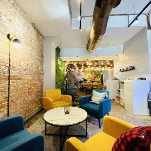 yellow and blue chairs and a coffee table