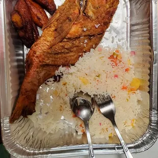 Whole snapper platter with coconut mango rice and plantains. Worth it