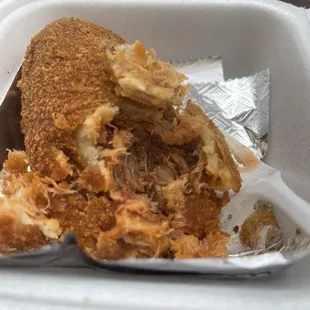 a sandwich in a styrofoam container