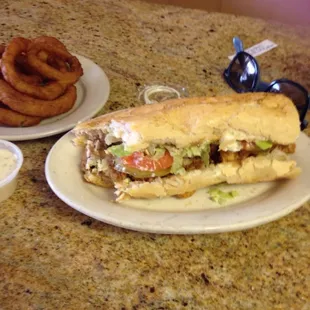 Shrimp and oyster Poboy and onion rings.  Yum.