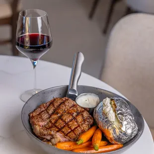 Enjoy a glass of wine from our unique wine list with you USDA Prime Ribeye Steak !