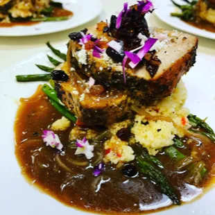 Pork Loin, candied demi-glace with cous cous