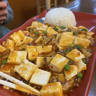 tofu and rice on a red plate