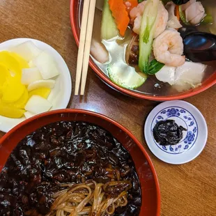 a bowl of noodles and a bowl of soup