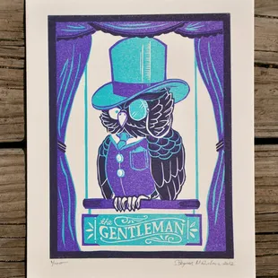 The Gentleman - a letterpress owl suited up with a top hat wearing a monocle. a Collaboration with local tattooer, Steven Bayman