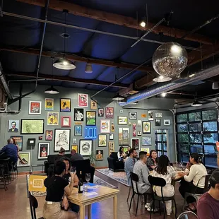 people sitting at tables in a restaurant