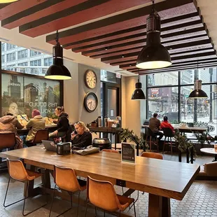 a restaurant with a long table and chairs