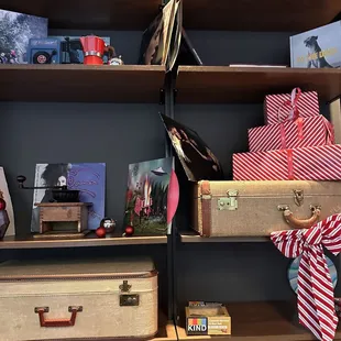 a shelf full of suitcases