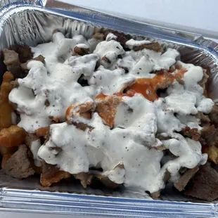 a container of meat and gravy