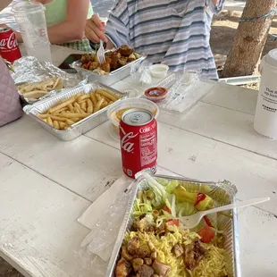 a family eating at a picnic table