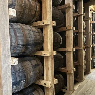 barrels stacked on wooden shelves