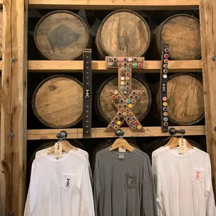a row of barrels and t - shirts