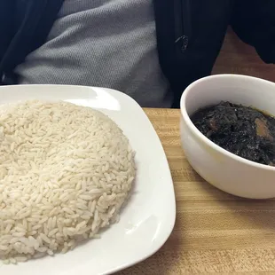 a plate of rice and a bowl of soup