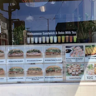 Front window with menu pictures at Ty Sandwich Shop