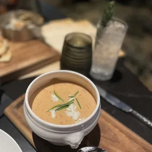 Crab bisque with rosemary cucumber mocktail in the background