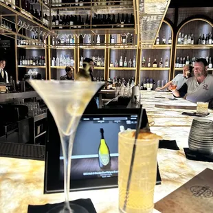 The Boss cocktail and a classic martini, not dirty with blue cheese stuffed olives