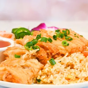 a plate of fried chicken and rice