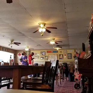 two people standing in the dining room