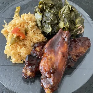 Henny wings, collard greens ,and Rice and Peas