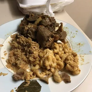 Oxtails,The rice was considered a side, what? it looked like Spanish rice with chick peas in it.that s** look like Ray Charles cooked it.