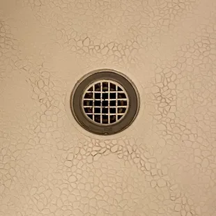 The shower that has been cleaned full of clogged hair