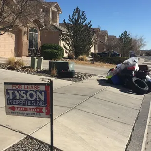 Tyson Rental property with trash prior tenants trash pile that Tyson ignored when they posted their "For Lease" sign.