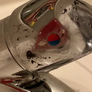 The bathroom that has been "cleaned" on the faucet