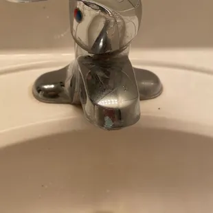 The other bathroom that was cleaned with toothpaste on the sink