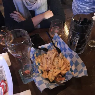 Cheese Fries and Empty Beer Glasses