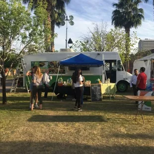 people standing in front of a food truck