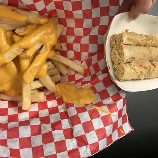 a basket of cheese fries and a sandwich