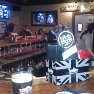  a bar with a beer on the counter