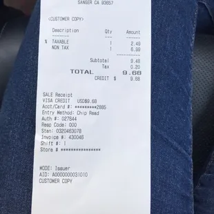 Receipt for being charged $6.99 for a gallon of milk.