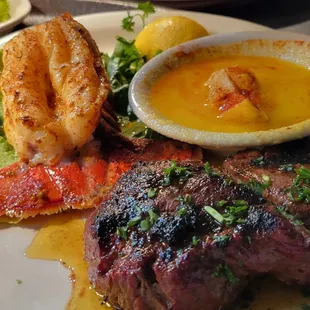 Surf &amp; Turf -
8oz. Filet Mignon &amp; 6oz. Maine Lobster Tail. Served with lemon, butter sauce.