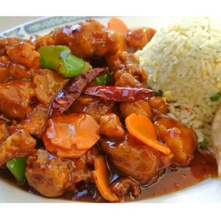 a plate of food with rice and meat