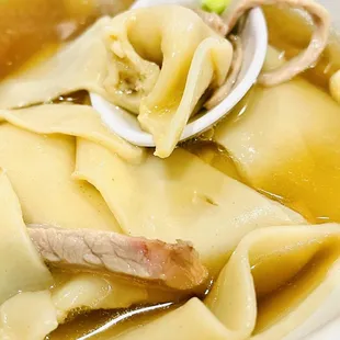 The wonton soup broth is spectacularly subtly fragrant.  Where is the filling?