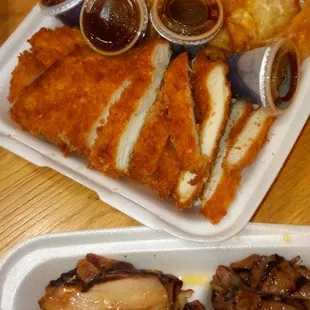 Chicken Katsu and Gyoza with sauces, from their family meal option.