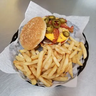 The new Bomb Burger with mouth watering nacho cheese, bacon, jalapenos, crushed tortilla chips, and much more!