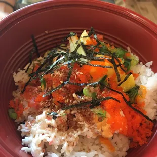Spicy tuna and spicy salmon bowl with masago, mango, seaweed, cucumber