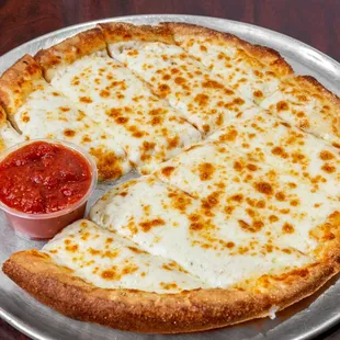 a cheese pizza with a slice taken out of it