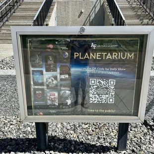 You can scan the QR code to find out the Planetarium's schedule or visit online at usafa.edu